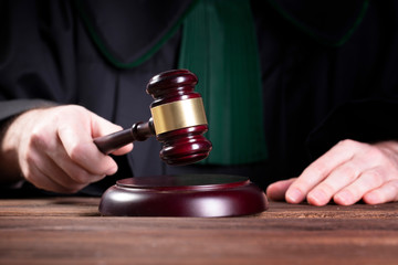 judge hits the gavel and pronunces final judgement