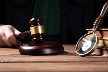 judge hits the gavel and pronunces final judgement. Law and justice concept