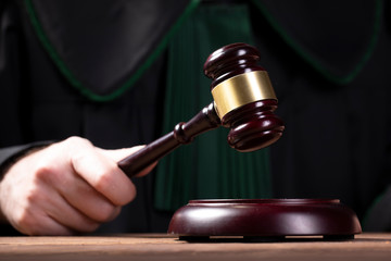 judge hits the gavel and pronunces final judgement. Law and justice concept