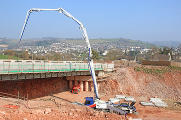 cement mixer pouring concrete on a bridge