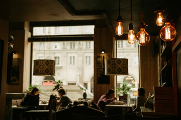 Cozy cafe atmosphere. Focus on bulbs