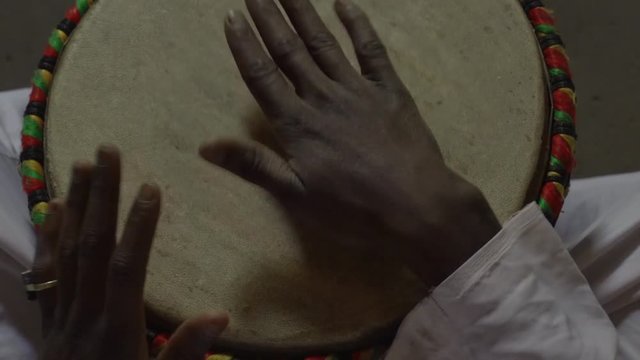Percussionist playing bata drums in Africa