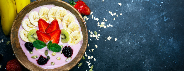Yogurt smoothie bowl. Vegetarian healthy food (berries, yogurt, muesli, fruit)