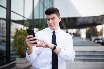 Casual businessman check connection on mobile phone