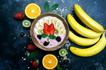 Fototapeta na wymiar Yogurt smoothie bowl. Vegetarian healthy food (berries, yogurt, muesli, fruit)