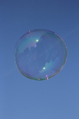 Soap Bubble floating in blue sky 1