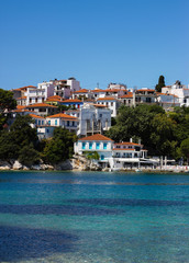 Fototapeta na wymiar View of typical white houses of Skiathos town in Skiathos island, Aegean sea, Sporades, Greece