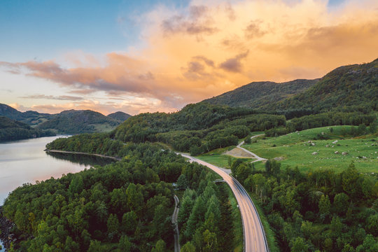 a lake in Norway with beautiful sunrise in background