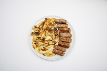 Minced meat rolls and potato chips from oven isolated on white background