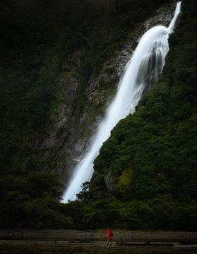 Photographer at Lady Bowen Falls, Milford Sound, Fiordland National Park, UNESCO World Heritage Site, South Island, New Zealand, Pacific