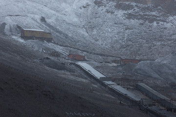 The sudden abandoned russian mining town Pyramiden. coal mine alongside the hill, Isfjorden,...