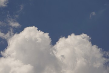 Amazing white fluffy clouds and blue sky on the background, Spring in Georgia USA.