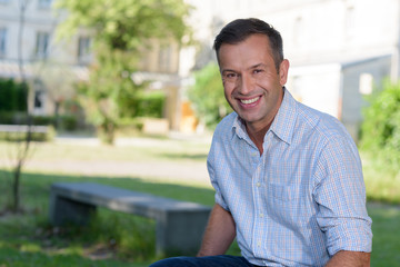 portrait of smiling mature man outdoors