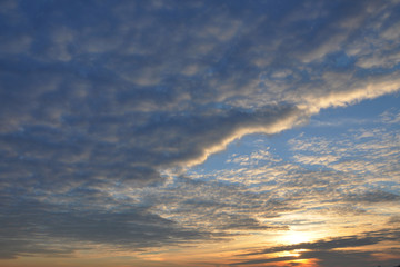 blue sky closes with dark clouds before a thunderstorm
