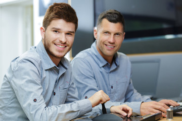 two men working in flat screen television