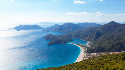 Oludeniz is a resort village on the southwest coast of Turkey. It’s known for the blue lagoon of Oludeniz Tabiat Parki and the wide, white Belcekiz Beach.