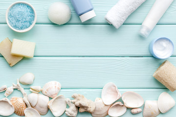 natural cream, lotion, salt with Dead Sea minerals for homemade spa frame on mint green background top view mockup