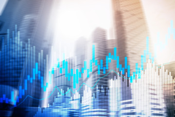 Stock trading candlestick chart and diagrams on blurred office center background.
