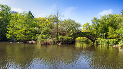 View of spring landscape in Central Park. Gapstow bridge in midtown Manhattan, New York City. USA