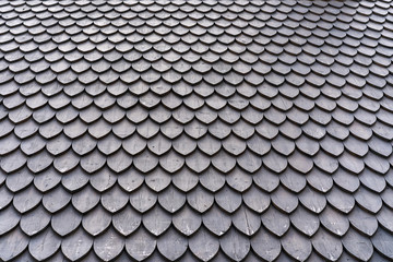 Fototapeta premium wooden tiles on the roof of a historic building