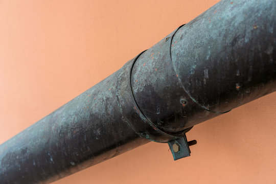 drain pipe with hose clamp on the wall