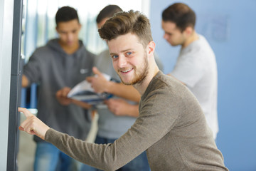 Fototapeta premium happy student next to lockers at the college