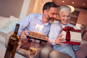 Romantic mature couple enjoying at home