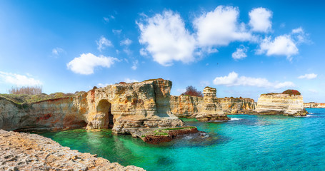 Fototapeta na wymiar Picturesque seascape with cliffs, rocky arch at Torre Sant Andrea
