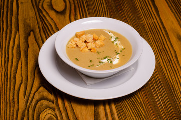 Minestrone, italian vegetable soup with pasta on wooden table. Top view