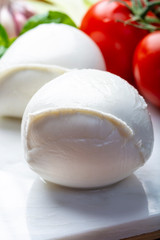 Balls of buffalo mozzarella, soft Italian scheese made from the milk of Italian Mediterranean buffalo