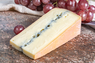 Morbier semi-soft cow milk French cheese with black mold layer