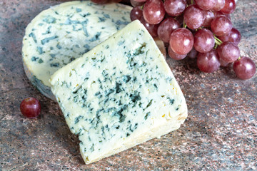 Fourme Ambert and Blue Auvergne semi-hard AOP French blue cheeses made from raw cow milk in Auvergne, France