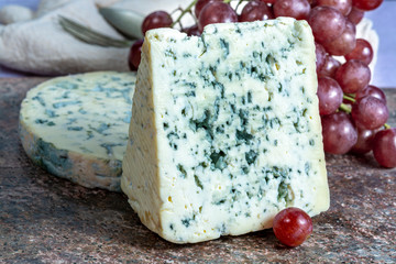 Fourme Ambert and Blue Auvergne semi-hard AOP French blue cheeses made from raw cow milk in Auvergne, France