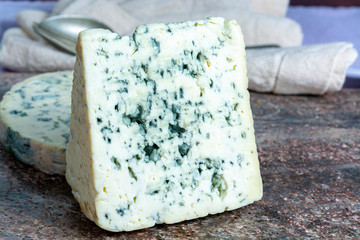 Fourme Ambert and Blue Auvergne semi-hard AOP French blue cheeses made from raw cow milk in Auvergne, France
