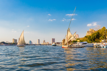 Cairo, Egypt - April 19, 2019: View of Cairo with boats sailing on the Nile river, Egypt