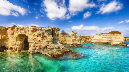Picturesque seascape with cliffs, rocky arch at Torre Sant Andrea - obrazy, fototapety, plakaty