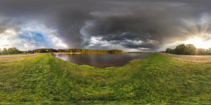 full seamless spherical hdri panorama 360 degrees angle view on the shore of lake in evening before storm with black clouds in equirectangular projection, ready VR virtual reality content