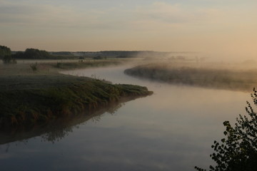 Fototapeta na wymiar Misty curly river landscape in summer morning
