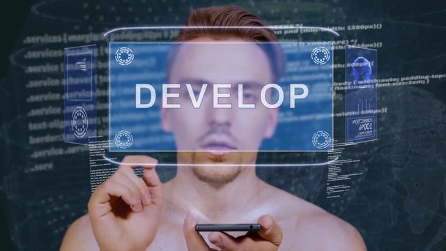 Young man interacts with a conceptual HUD hologram with text Develop. Guy with future technology mobile screen on background of the program code