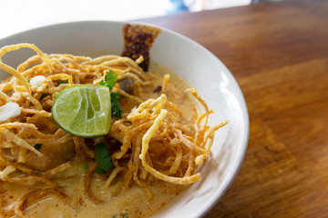 Tasty curry noodle soup with coconut milk chicken good for health with local natural spice and recipe, Northern Thai cuisine taken image in natural light