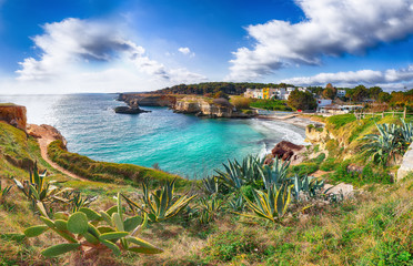 Beach Torre Sant'Andrea and islet Scoglio the Tafaluro
