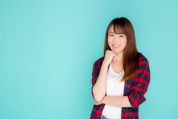 Obraz premium Beautiful portrait young asian woman wear clothes fashion travel smile expression confident enjoy summer holiday isolated blue background, model asia girl enjoy and cheerful, travel concept.