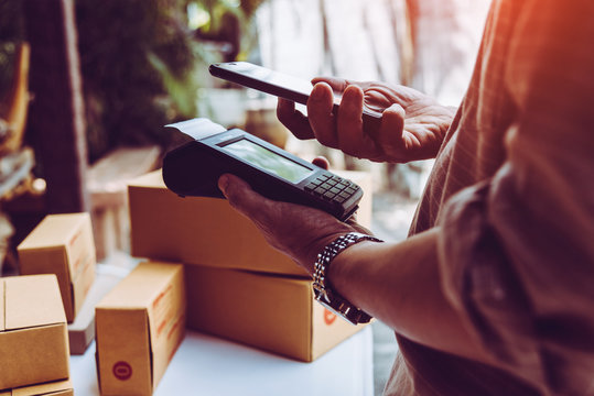 Man hand holding credit card reader nfc tecnology money machine.