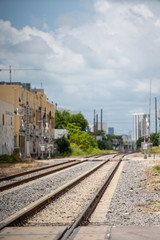 Fototapeta na wymiar Stock photo railroad tracks blurry background bokeh in the city