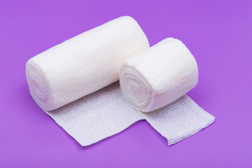 Hospital Grade Sterile Rolled Gauze on purple background.