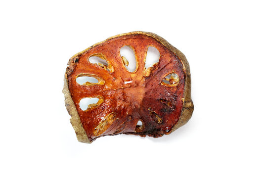 Image of dry bael fruit on white background. Food.