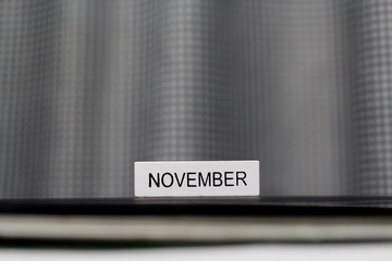 Month of November on a white wooden blocks calendar