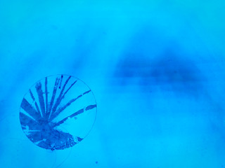 The light that shines on the wall with stained marks.