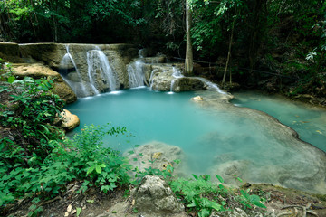 Emerald waterfall in a forest
