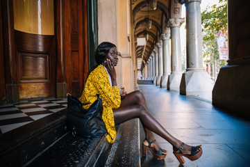 woman sitting on a doorstep